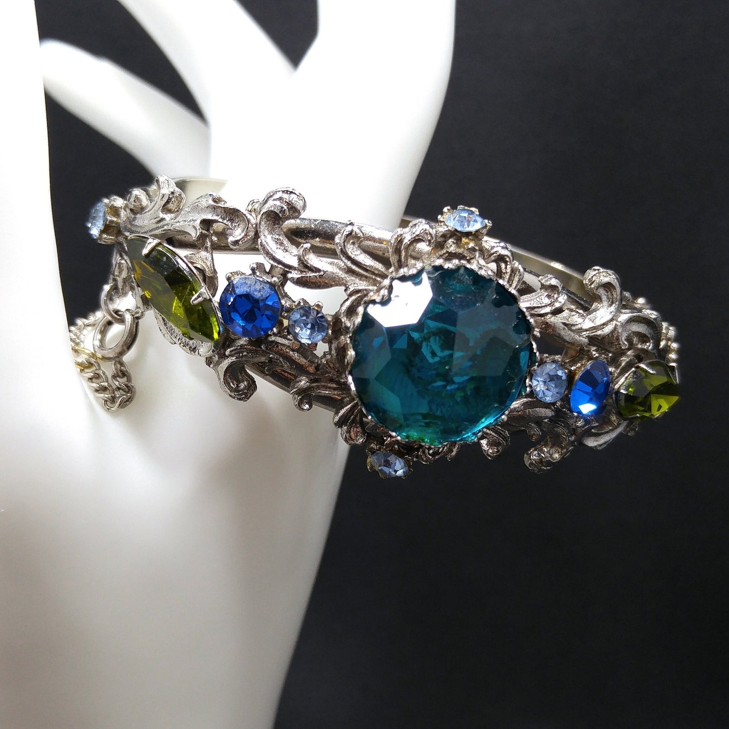 Teal Rivoli Rhinestone Hinged Bracelet, Safety Chain, Rhodium Plated, 1960s Vintage Jewelry