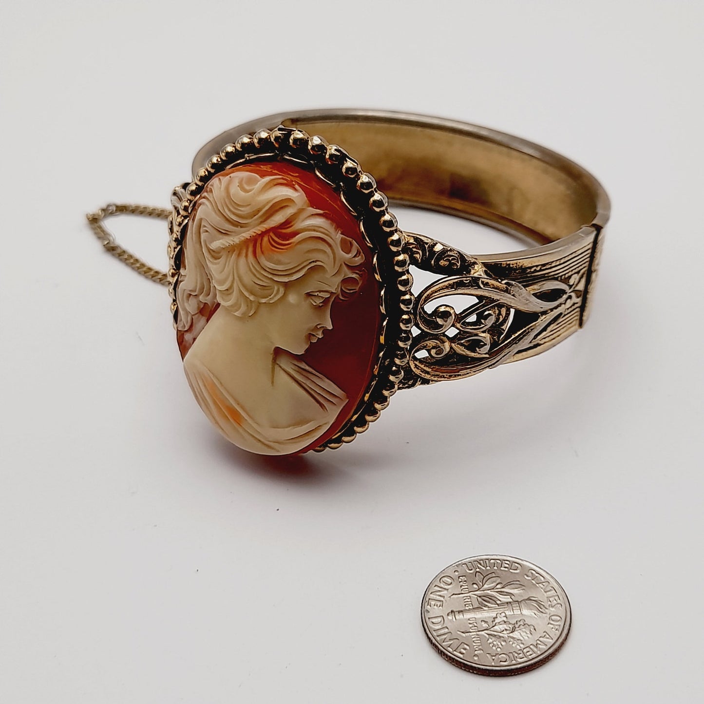 Vintage Lucite Cameo Gold Tone Hinged Bracelet with Safety Chain
