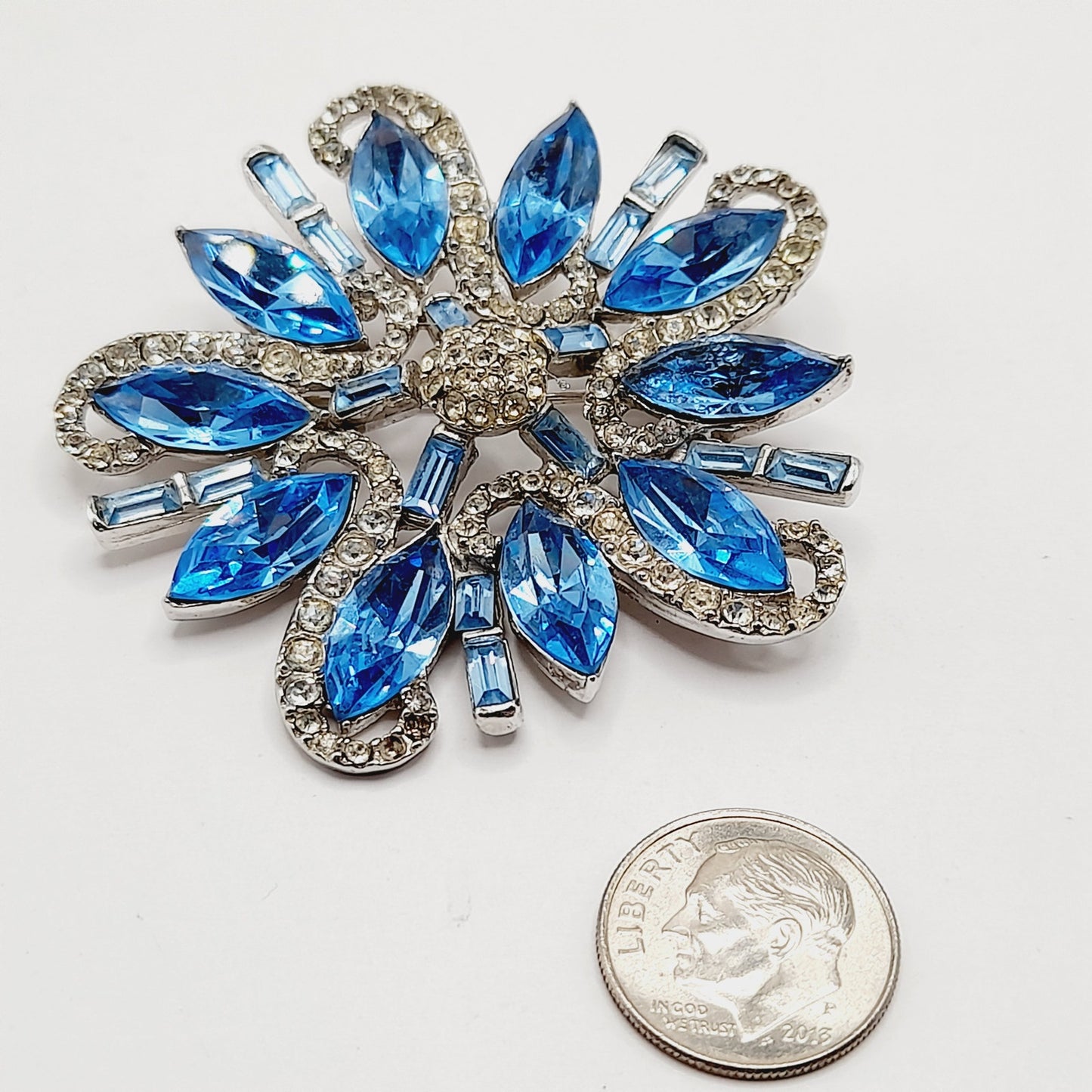 Vintage Rhodium Plated Blue Clear Rhinestone Floral Brooch – 2 1/4 Inches