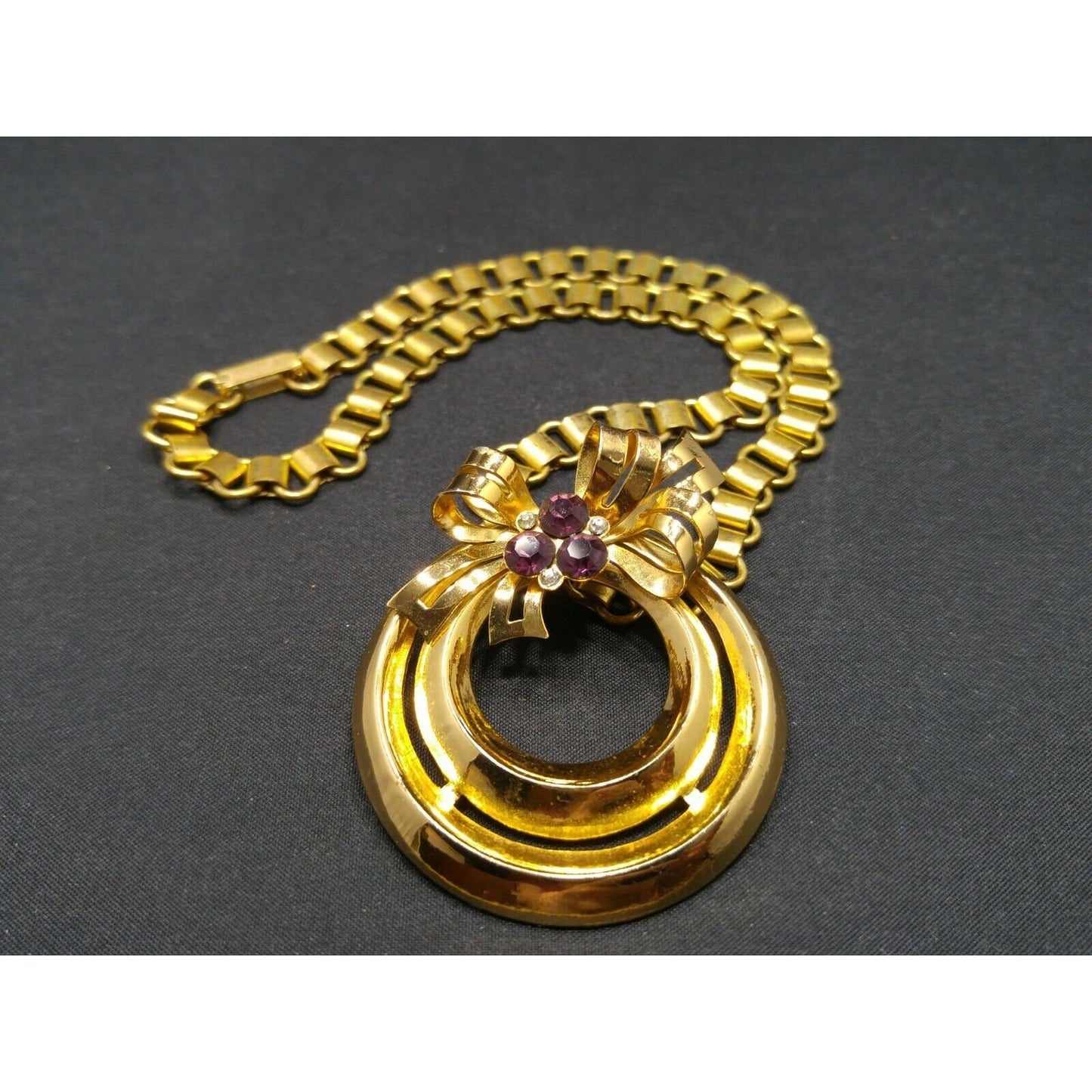 Coro 1948 Adolph Katz Bow Pendant Necklace, Gold Plate, Purple Rhinestones