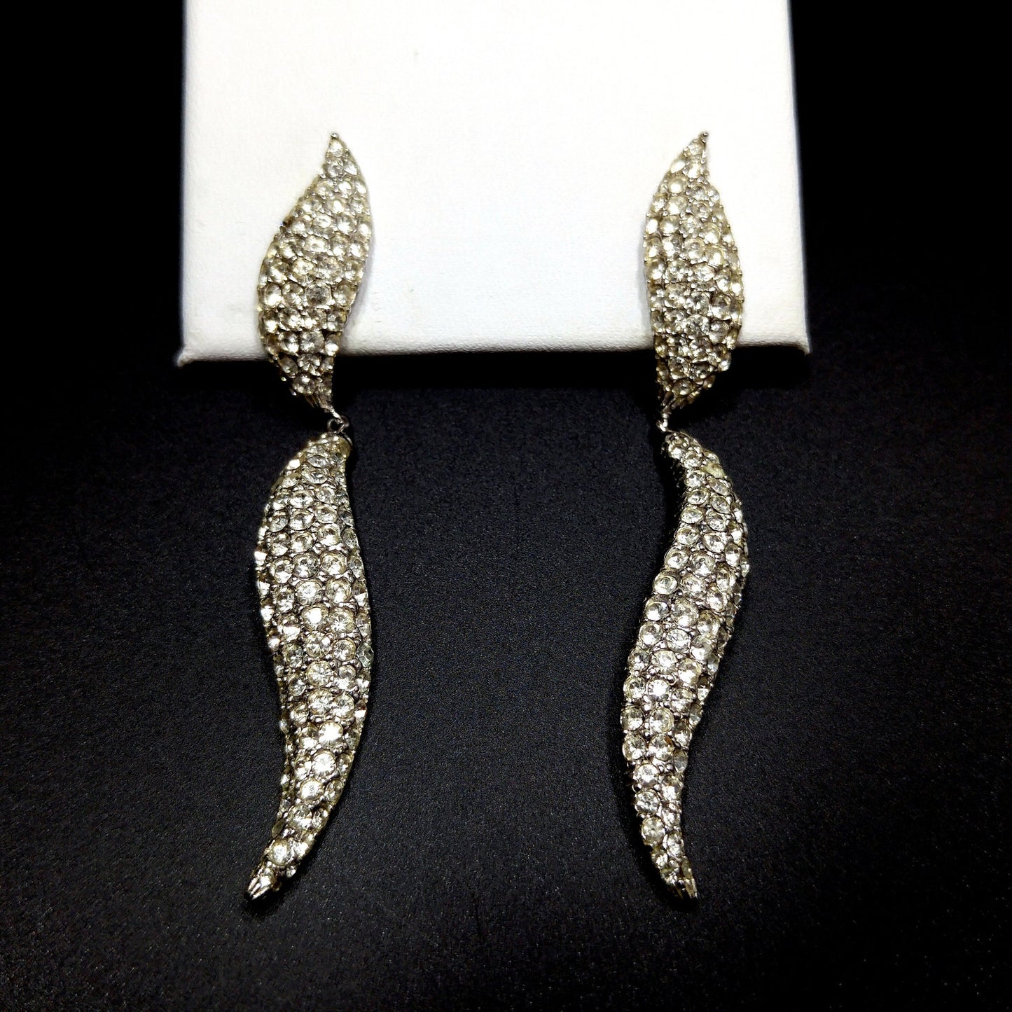 Ciner 1990s Rhodium Plated Pavé Rhinestone Curved Dangle Earrings – Vintage Designer Jewelry