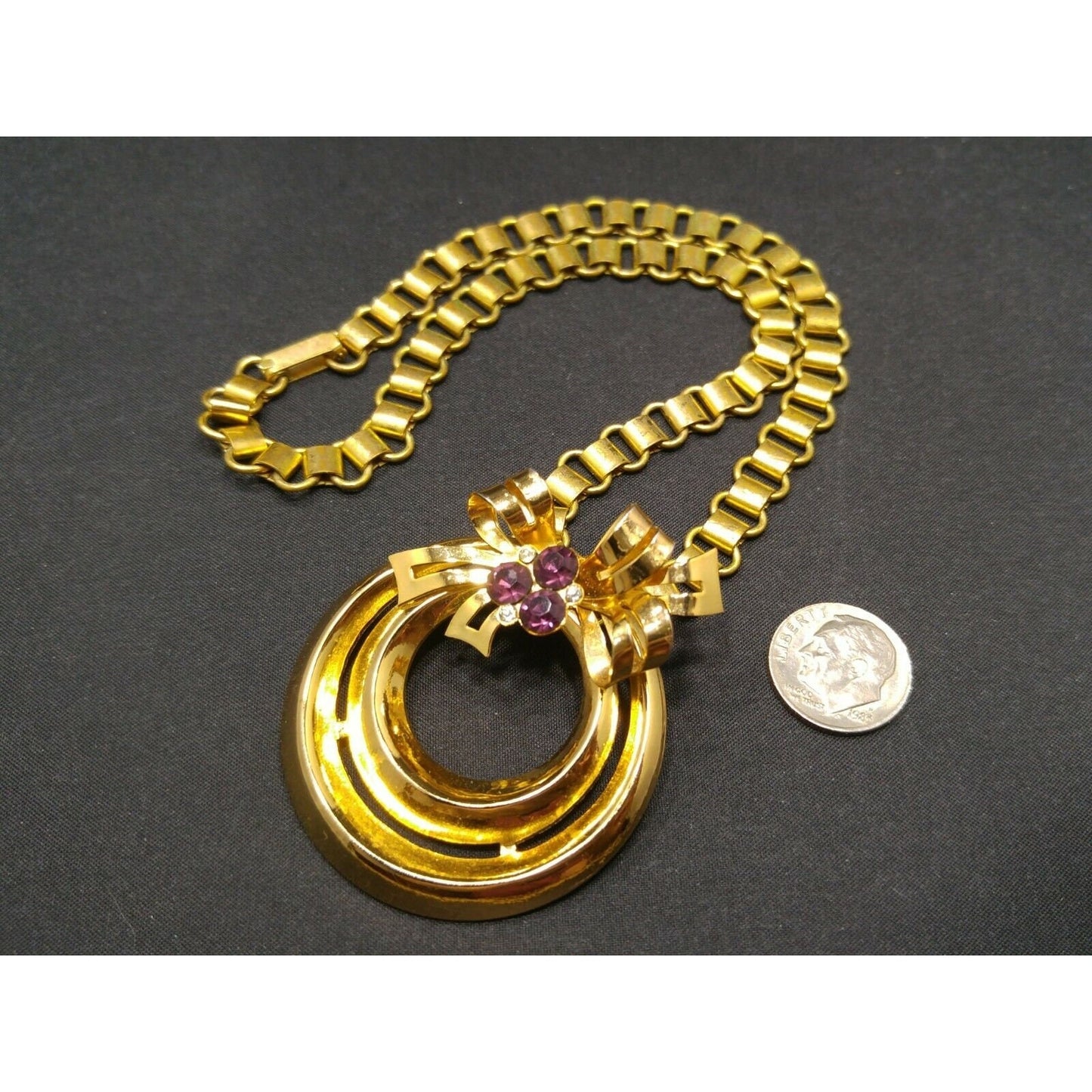 Coro 1948 Adolph Katz Bow Pendant Necklace, Gold Plate, Purple Rhinestones