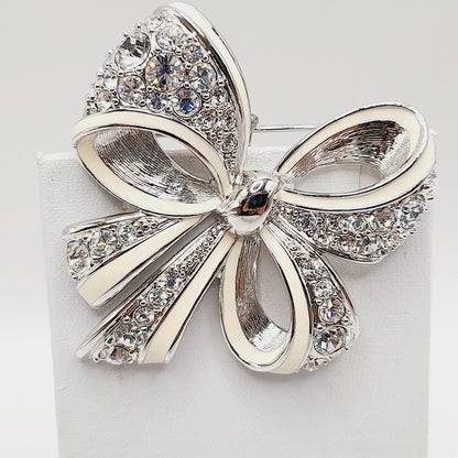 Vintage Nolan Miller Bow Brooch Rhodium Plated Clear Rhinestone White Enamel 2" Pin