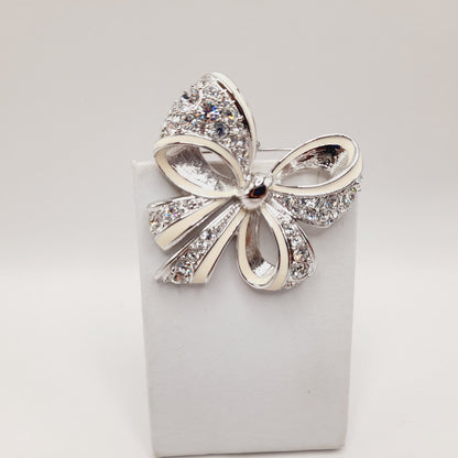 Vintage Nolan Miller Bow Brooch Rhodium Plated Clear Rhinestone White Enamel 2" Pin