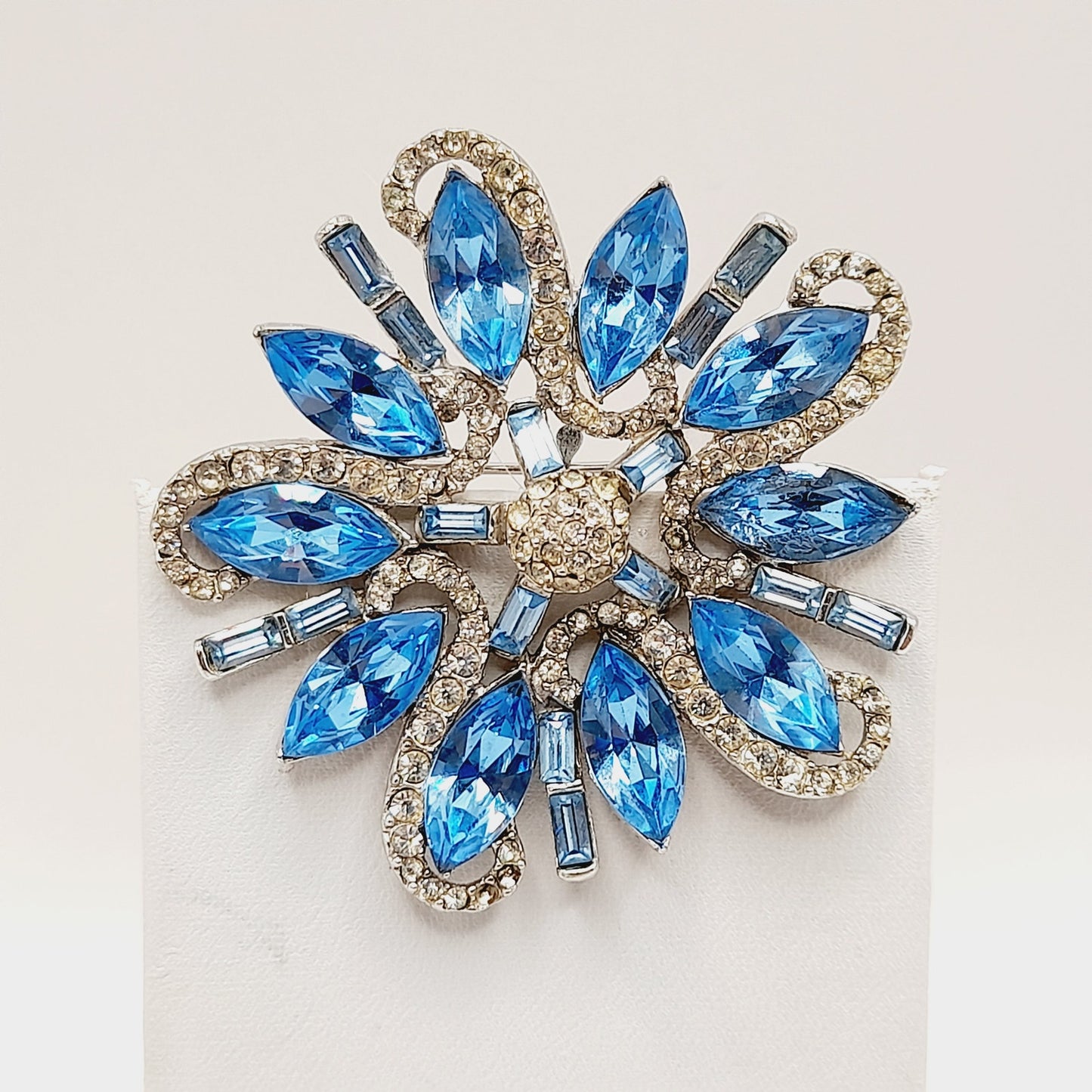 Vintage Rhodium Plated Blue Clear Rhinestone Floral Brooch – 2 1/4 Inches