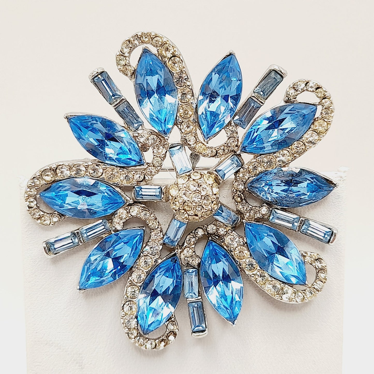 Vintage Rhodium Plated Blue Clear Rhinestone Floral Brooch – 2 1/4 Inches