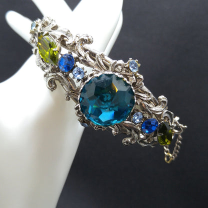Teal Rivoli Rhinestone Hinged Bracelet, Safety Chain, Rhodium Plated, 1960s Vintage Jewelry