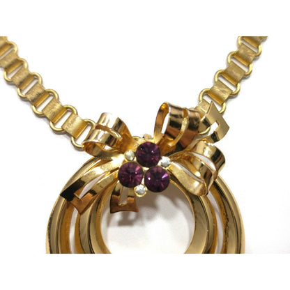 Coro 1948 Adolph Katz Bow Pendant Necklace, Gold Plate, Purple Rhinestones
