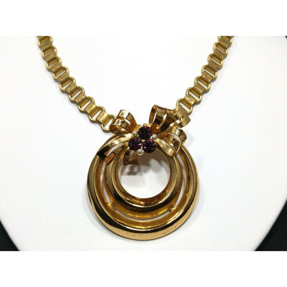 Coro 1948 Adolph Katz Bow Pendant Necklace, Gold Plate, Purple Rhinestones