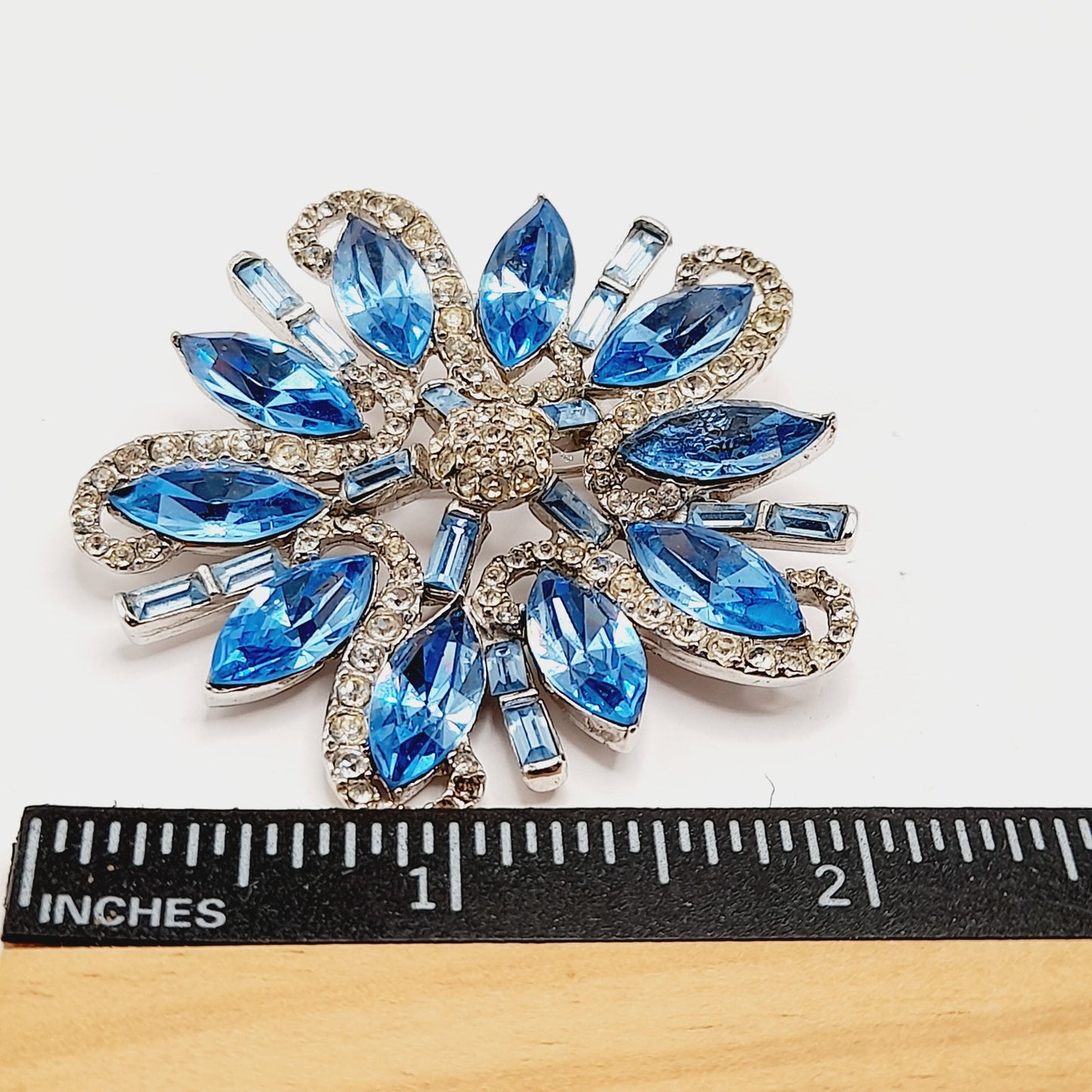 Vintage Rhodium Plated Blue Clear Rhinestone Floral Brooch – 2 1/4 Inches