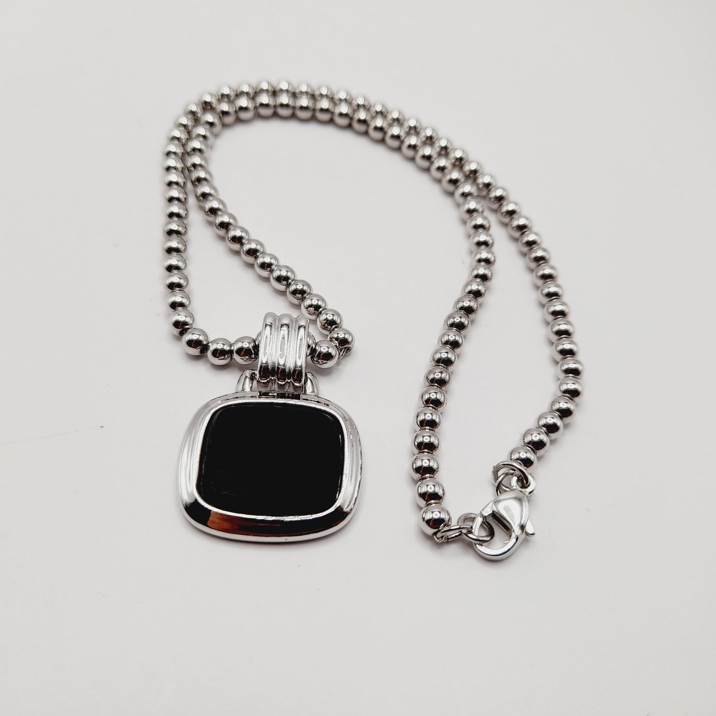 Monet Silver Tone Black Glass Pegasus Pendant Necklace – 16 Inches