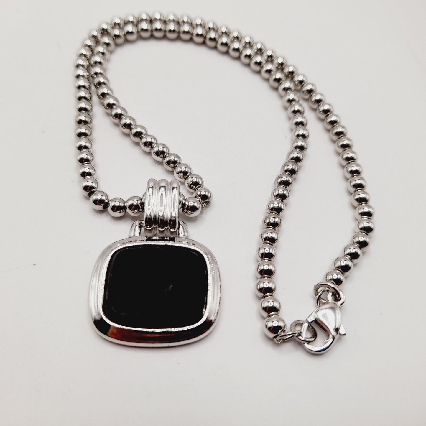 Monet Silver Tone Black Glass Pegasus Pendant Necklace – 16 Inches